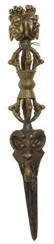 Appraisal: Tibetan brass phurba ritual dagger having figural mask pommel depicting