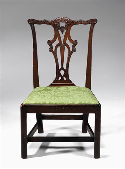 Appraisal: Chippendale mahogany side chair Carved and pierced crestrail carved with