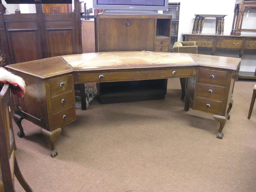 Appraisal: An early th century mahogany desk angled-shape with inset leather