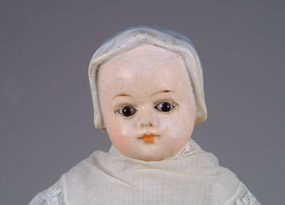 Appraisal: UNUSUAL - MOLDED BONNET COMPOSITION DOLL A shoulder head glass