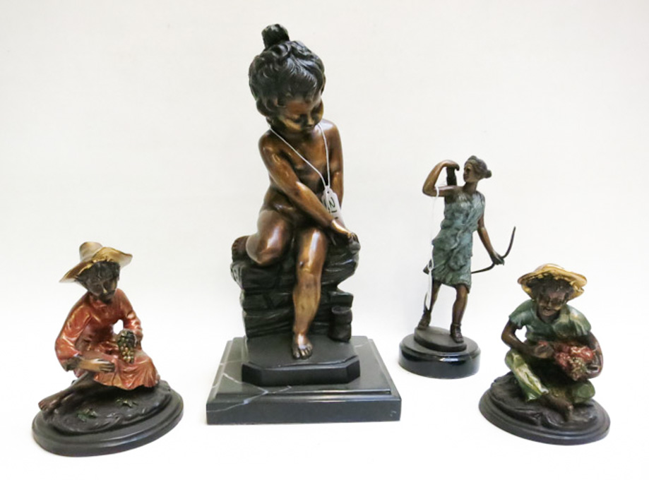 Appraisal: FOUR PATINATED AND POLYCHROME SCULPTURES including a seated cherub two