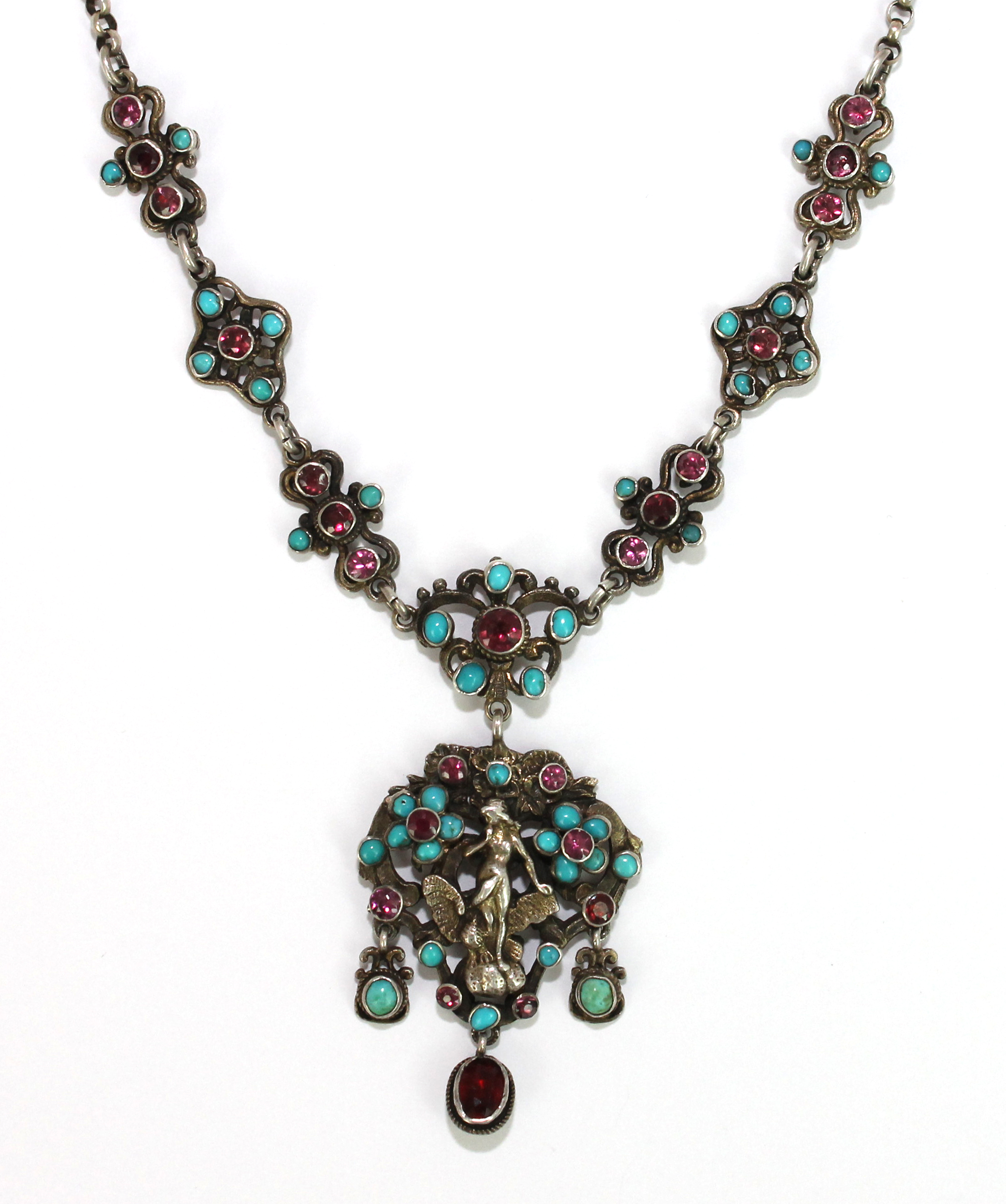 Appraisal: A turquoise garnet and gem set pendant necklace in a