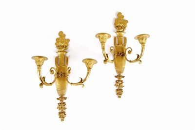 Appraisal: A pair of French Empire ormolu twin branch wall lights