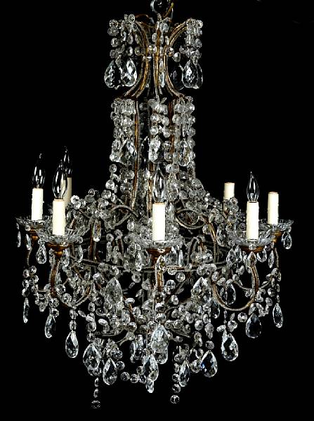 Appraisal: A Neoclassical style eight light chandelier with scroll arms and