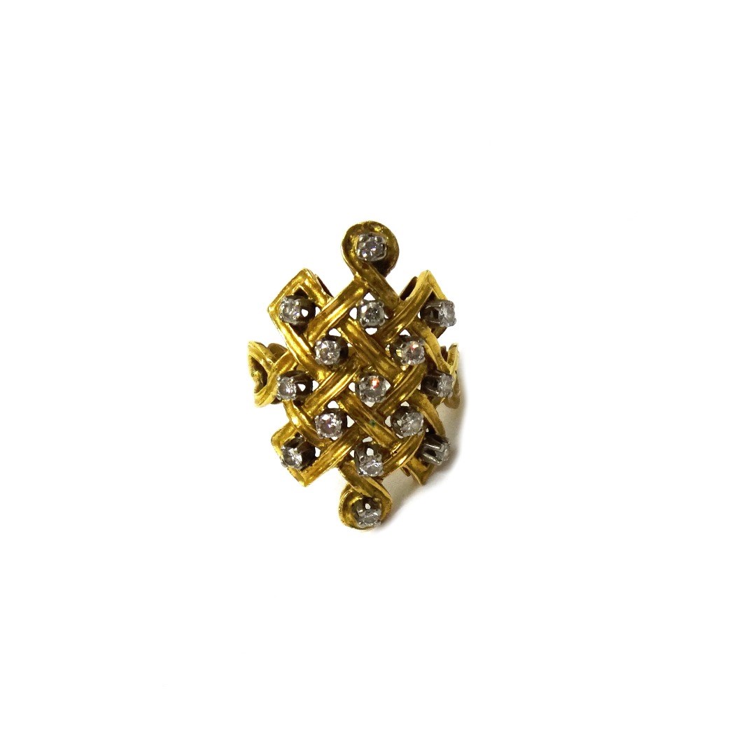 Appraisal: A gold and diamond set ring in a lattice work