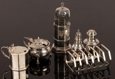 Appraisal: An octagonal silver caster Birmingham cm high two mustard pots