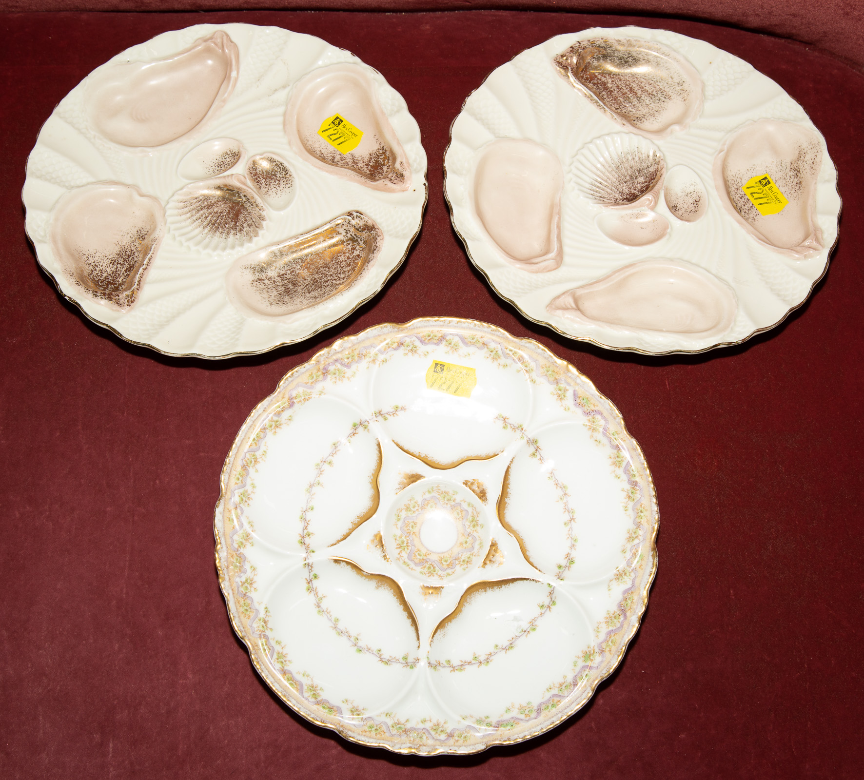 Appraisal: THREE PORCELAIN OYSTER PLATES Includes a French Theodore Haviland Limoges