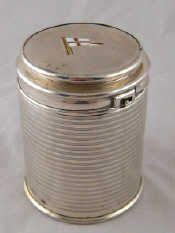 Appraisal: A silver bayonet lidded tin the body with ribbed machine