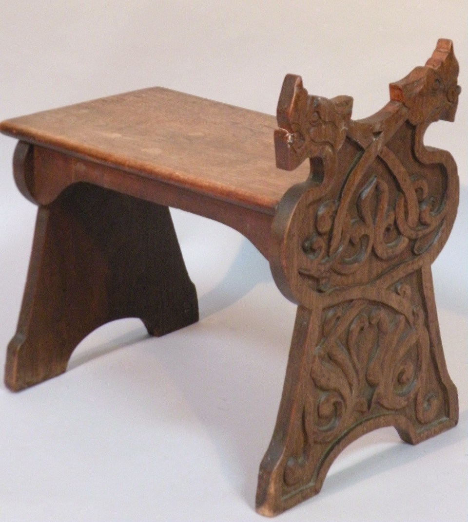 Appraisal: A heavily carved Jacobean style stool with rectangular top and