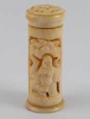 Appraisal: A turned and carved pierced ivory cylindrical container cm long