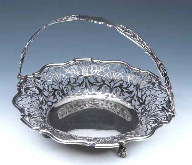 Appraisal: A CONTINENTAL OCTAGONAL SILVER BOWL decorated with fruit standing on