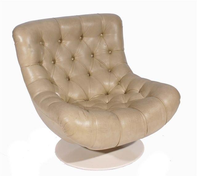 Appraisal: A 's cream leather button upholstered Parker Knoll chair standing