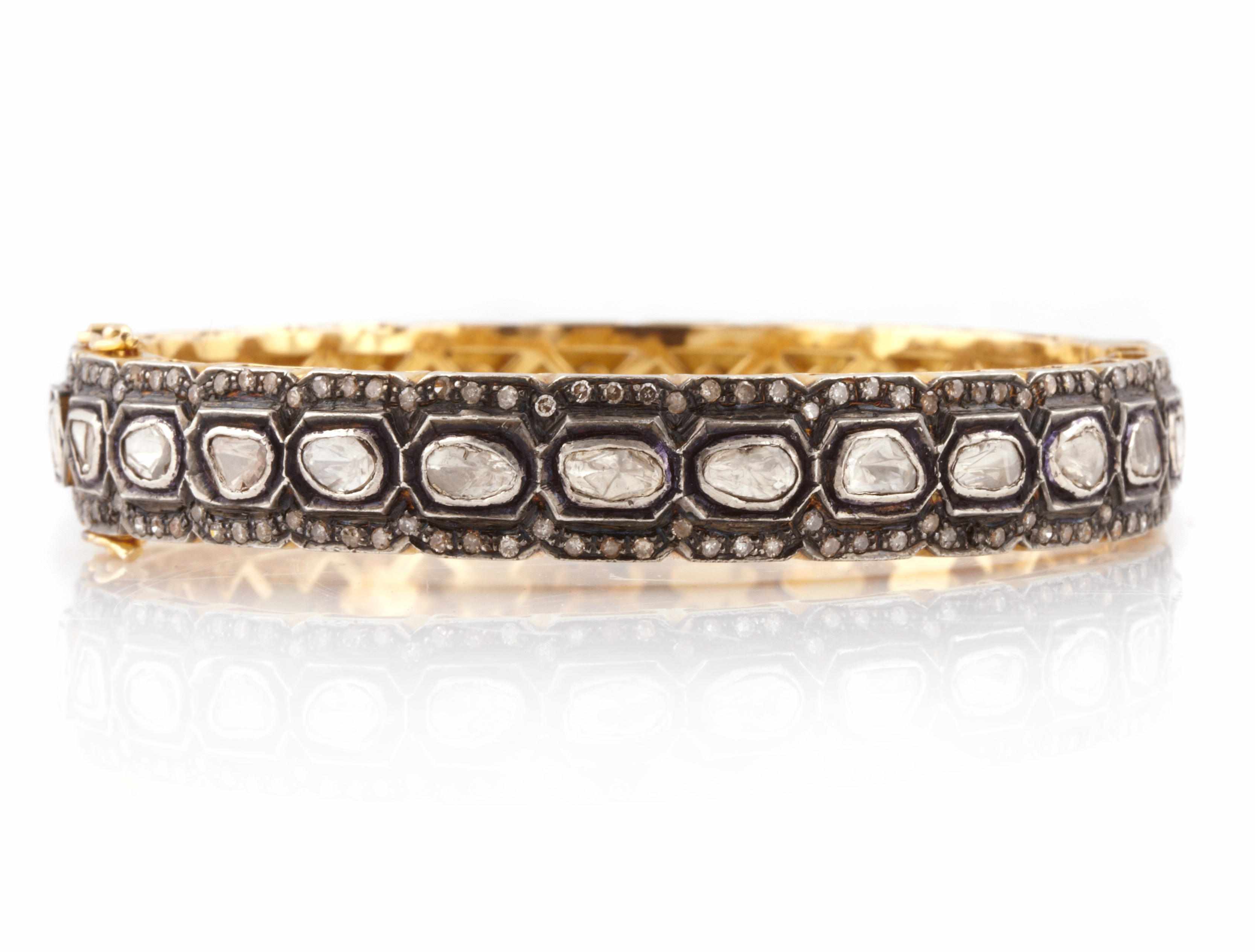 Appraisal: A rose-cut diamond and silver topped k gold bangle diameter