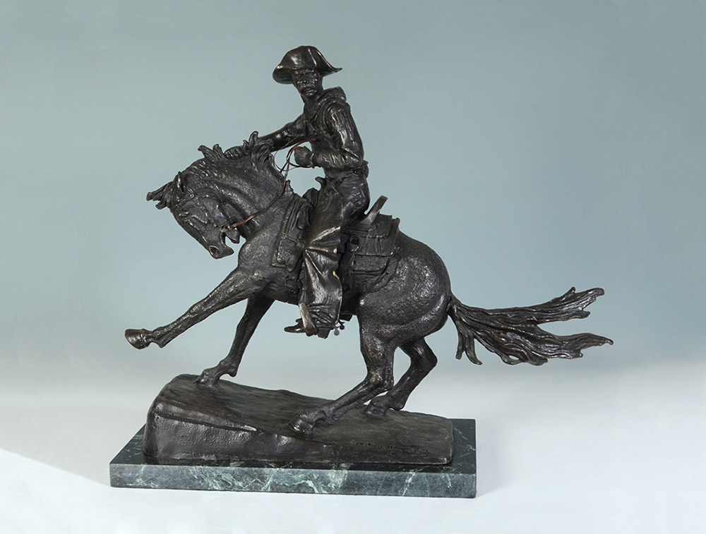 Appraisal: LARGE BRONZE COWBOY AFTER REMINGTON '' X '' affixed to