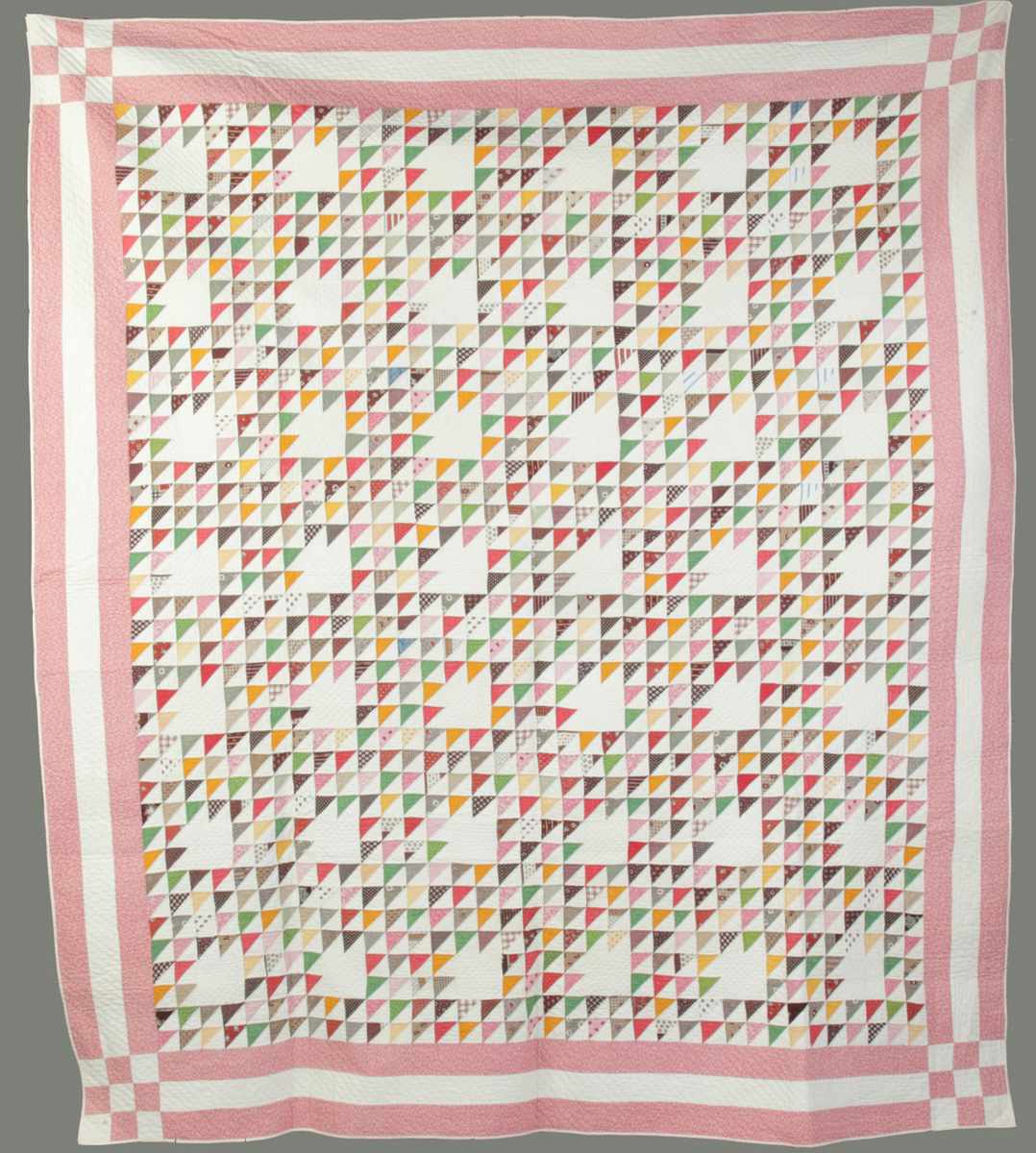 Appraisal: Multi-colored Flying Geese Quilt Pink borders minute quilting Very good