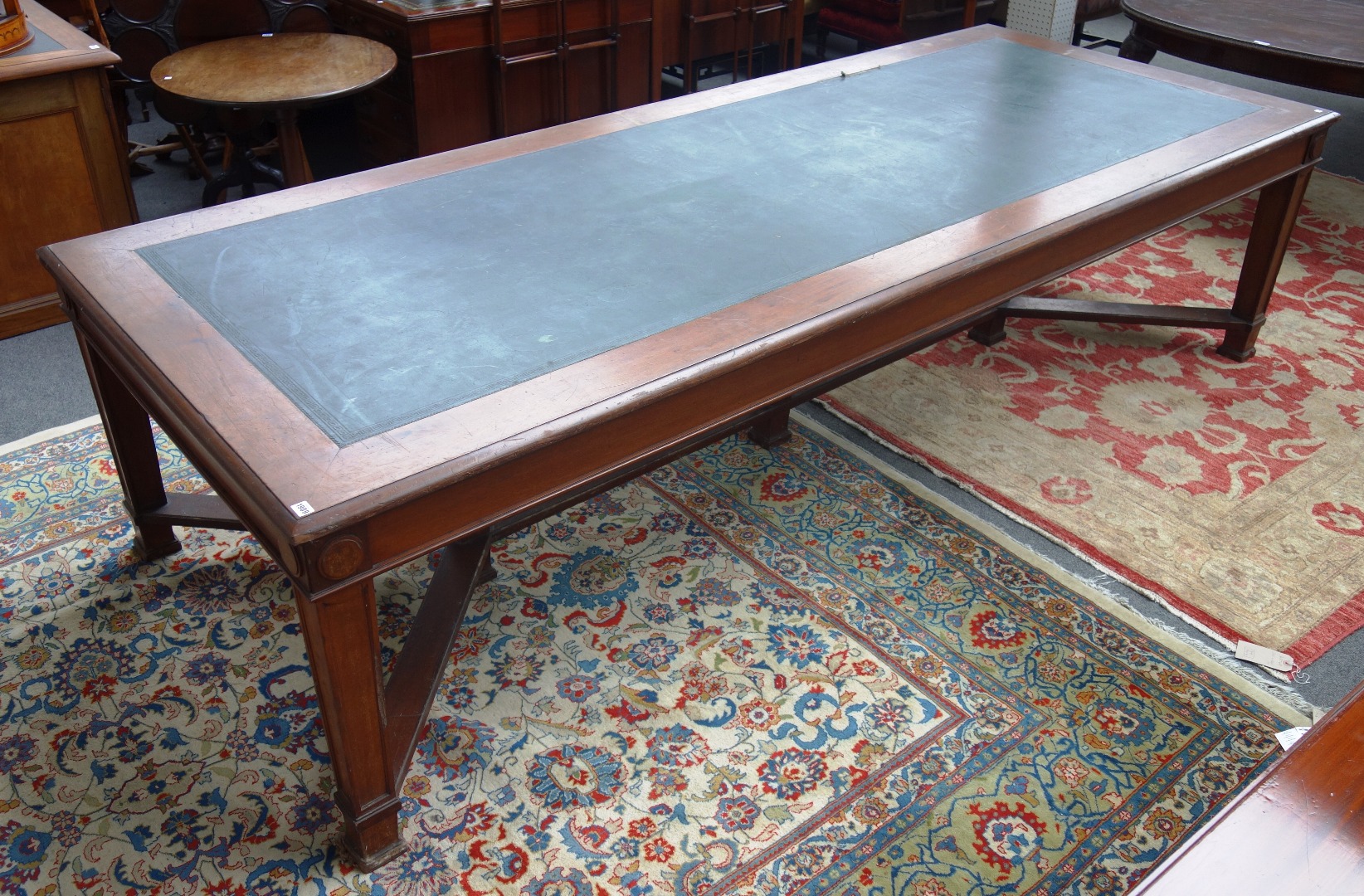 Appraisal: A large th century style mahogany library table the leather