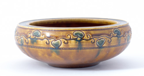 Appraisal: ROOKWOOD Carved Matt bowl with flat rim decorated by Sallie