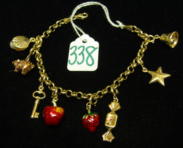 Appraisal: GOLD CHARM BRACELET all K yellow gold the chain bracelet