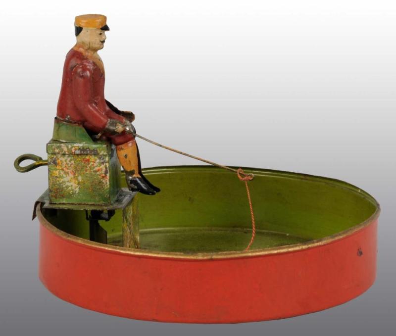 Appraisal: Tin Hand-Painted Man Fishing Toy Description German Working When wound