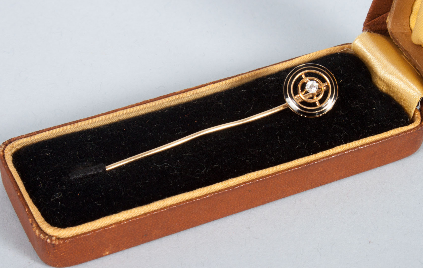 Appraisal: K gold and enamel stick pin with center diamond gold