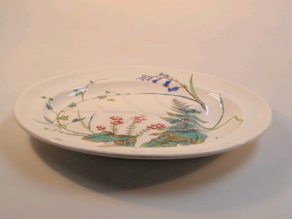 Appraisal: A Victorian pottery meat plate polychrome printed and painted with