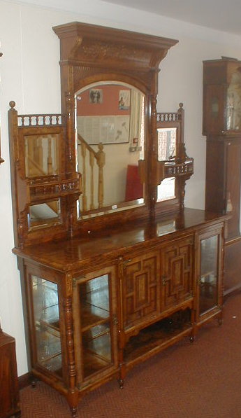 Appraisal: A Victorian figured walnut mirror back chiffonier with gilt scratch