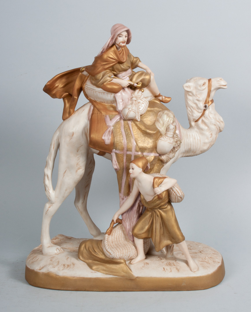 Appraisal: Royal Dux porcelain Arab merchant group modeled as man riding