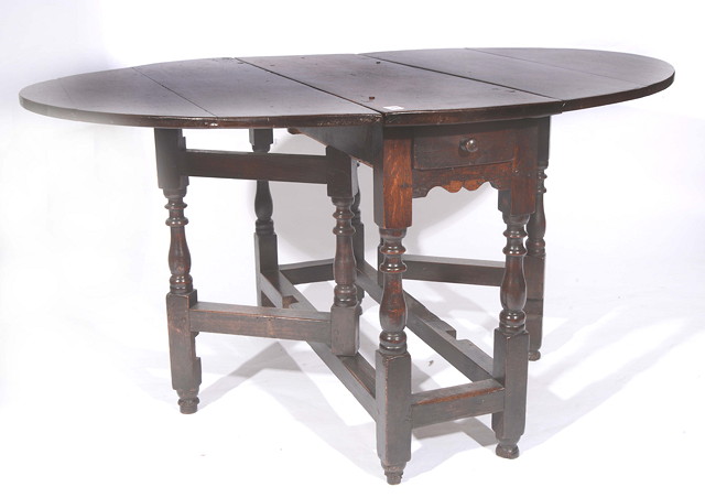 Appraisal: AN TH CENTURY OAK OVAL GATELEG DINING TABLE with end