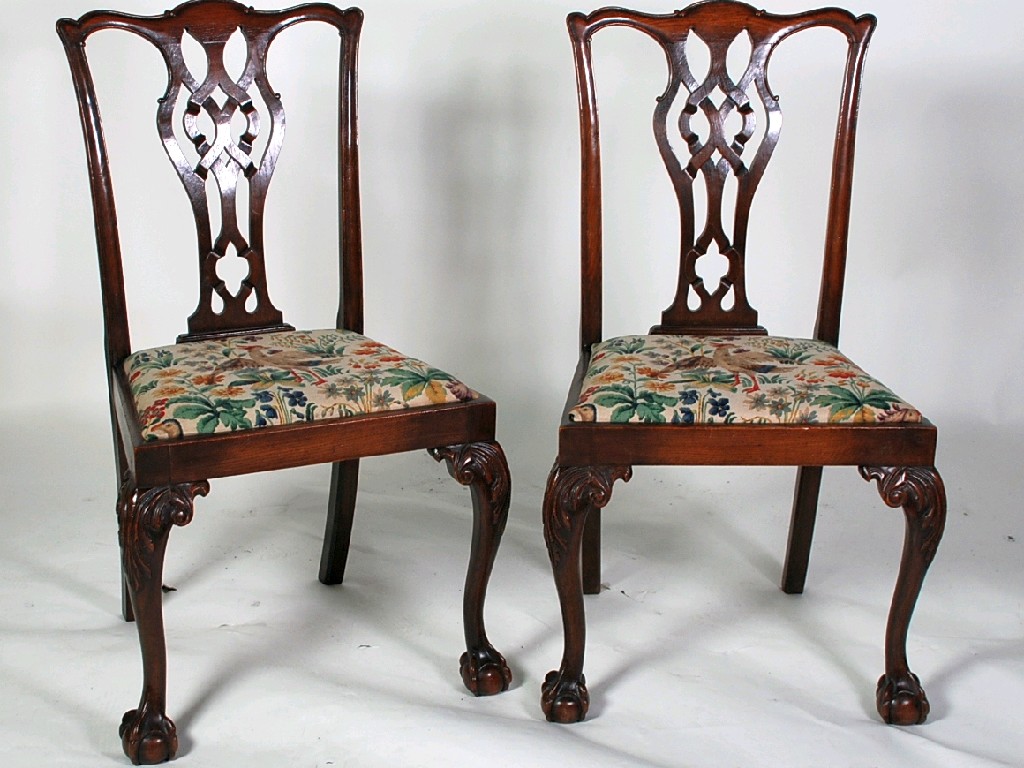 Appraisal: SET OF FOUR EARLY TWENTIETH CENTURY CARVED OAK DINING CHAIRS