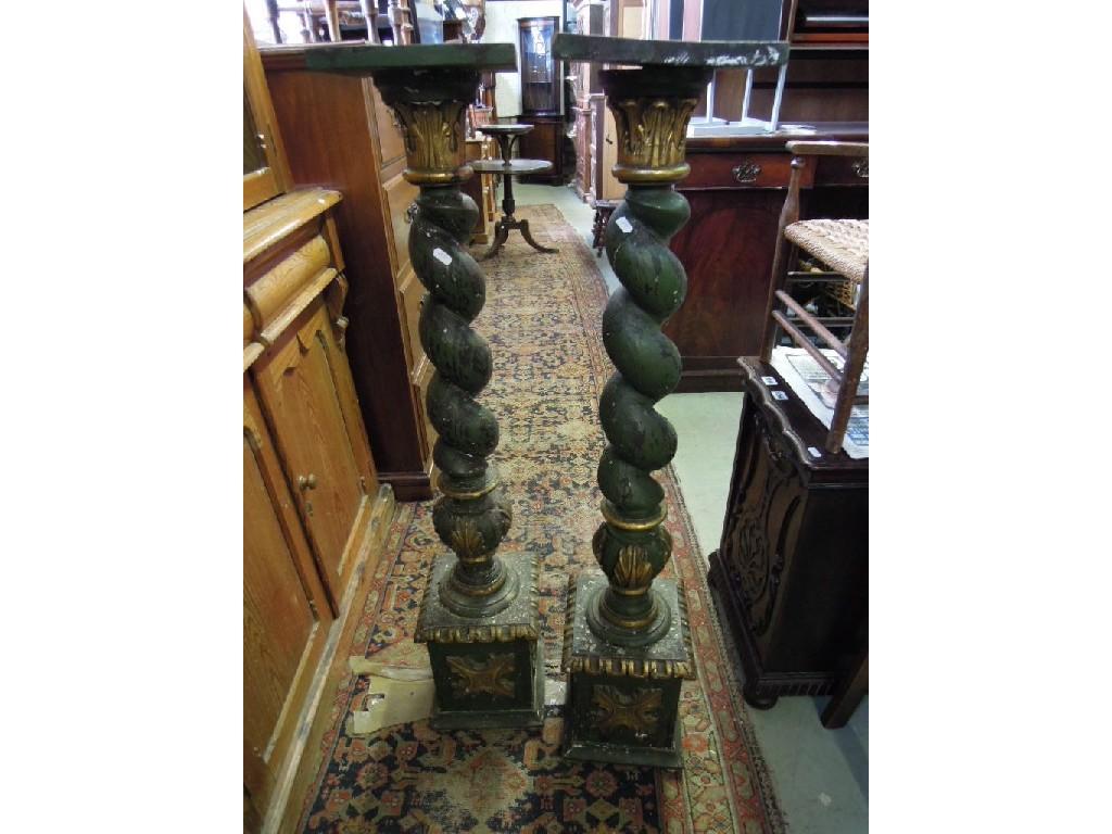 Appraisal: A pair of decorative painted pine torcheres with gilded carved