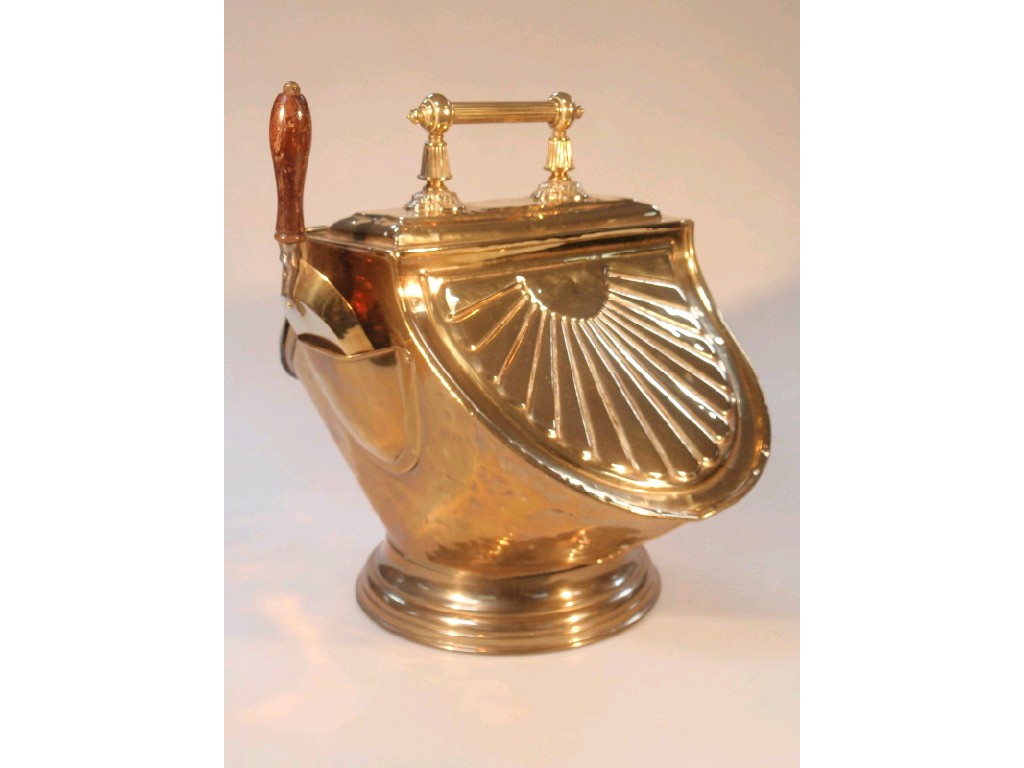 Appraisal: A Victorian embossed brass coal scuttle with reeded handle and