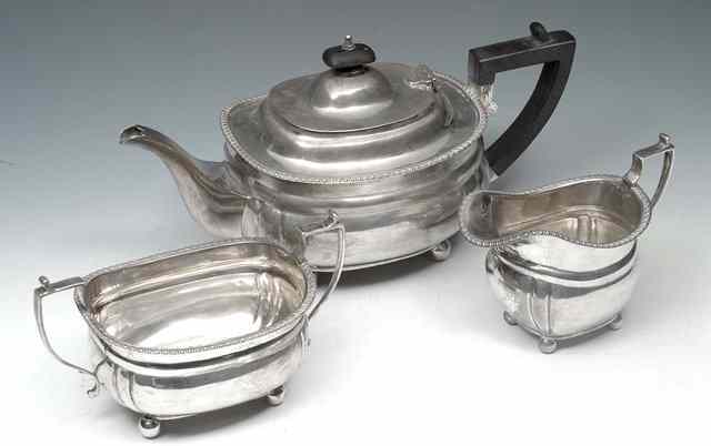 Appraisal: A THREE PIECE SILVER TEASET with gadrooned edge each piece