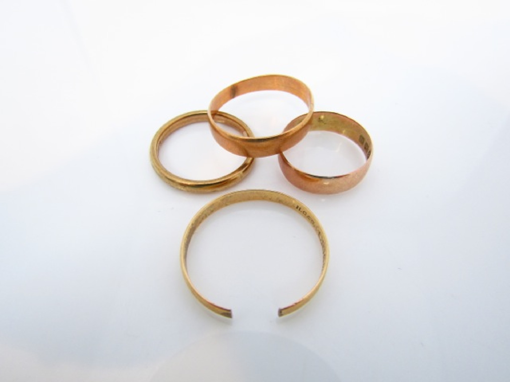 Appraisal: Two ct gold wedding bands one cut g in total