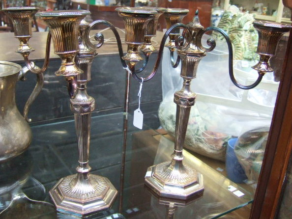 Appraisal: A pair of plated on copper three light candelabra each