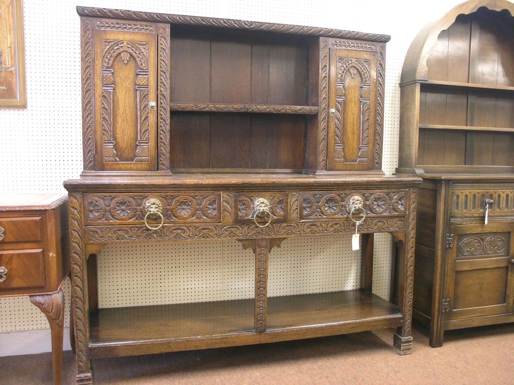 Appraisal: A late Victorian dark carved oak sideboard raised back with