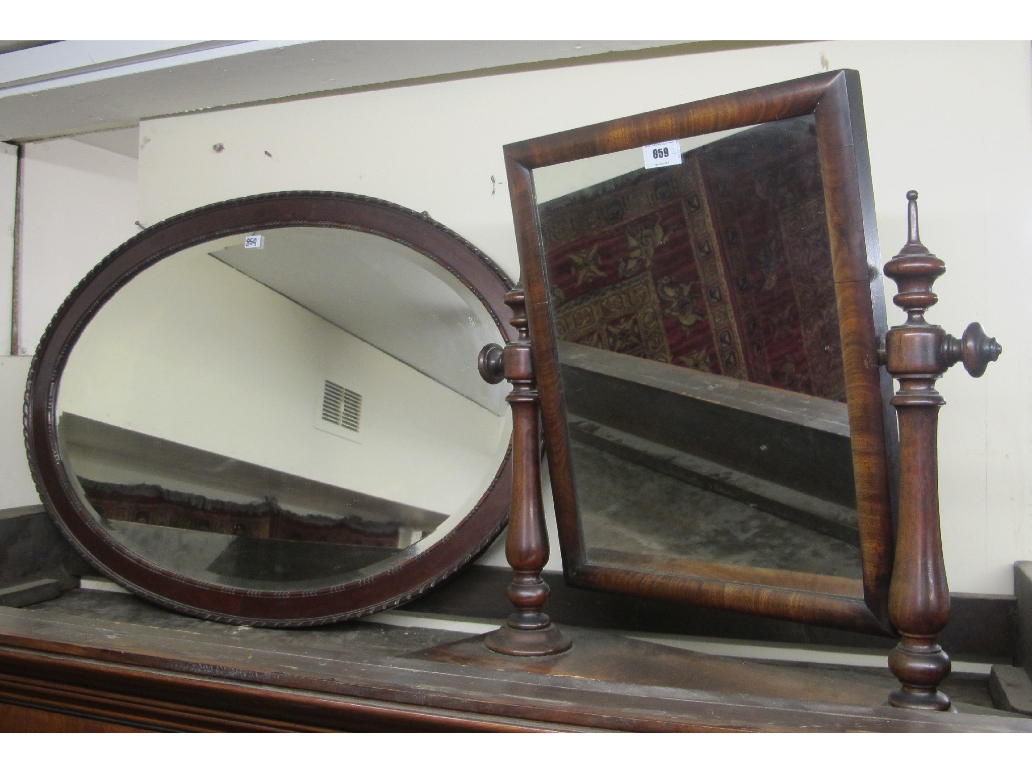 Appraisal: Victorian mahogany toilet mirror with a mahogany framed oval wall