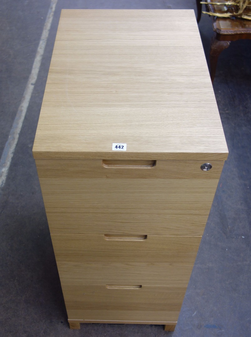 Appraisal: An Abacus three drawer filing cabinet by John Lewis with