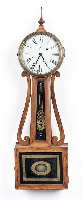 Appraisal: Eglomise Banjo Clock DESCRIPTION Federal style banjo clock Wood scrolls