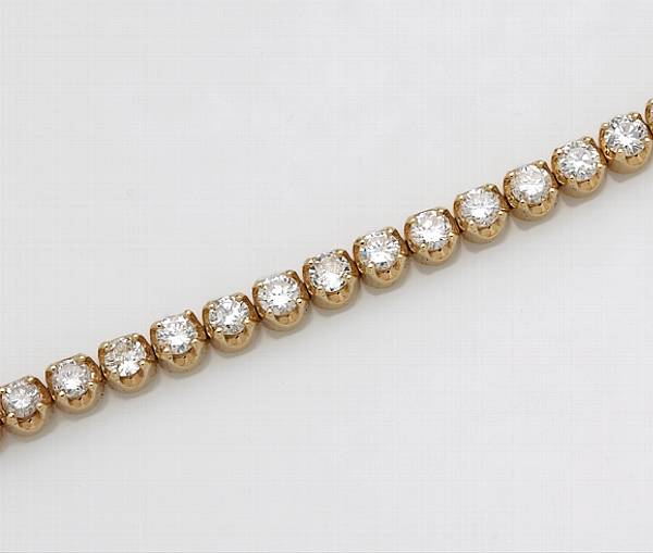 Appraisal: A diamond and fourteen karat gold line bracelet estimated total