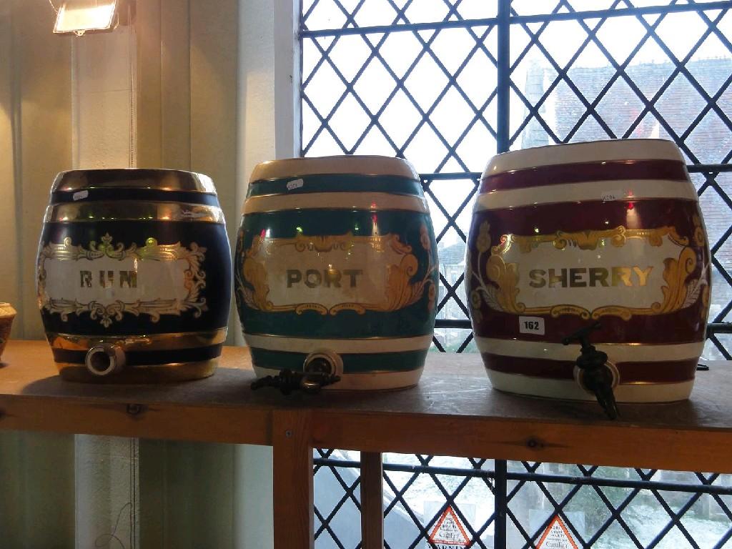 Appraisal: Three ceramic spirit barrels with painted and gilded cartouches inscribed