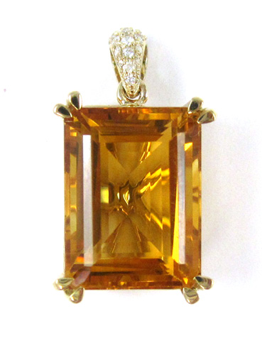 Appraisal: CITRINE AND DIAMOND PENDANT IN FOURTEEN KARAT GOLD SETTING the