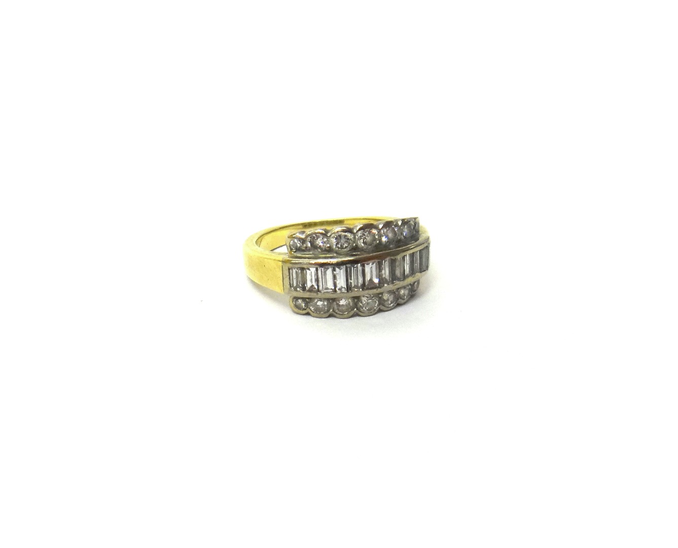 Appraisal: A gold ring mounted with a row of baguette diamonds