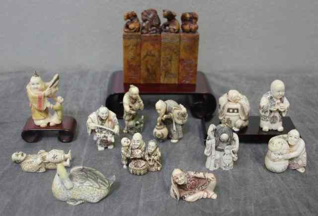 Appraisal: Asian Netsuke Lot Includes carved and dyed and vintage ivory