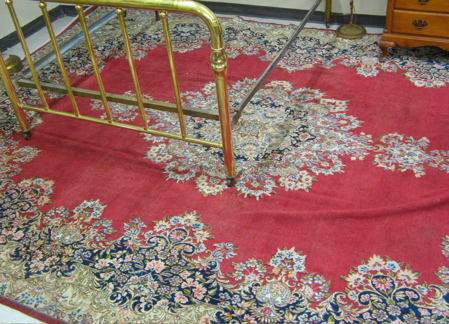 Appraisal: SEMI-ANTIQUE PERSIAN KERMAN CARPET centering a large floral medallion on