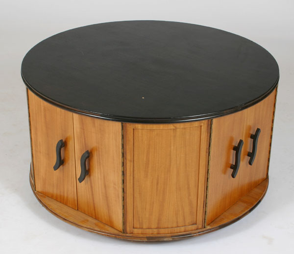 Appraisal: Round mahogany cocktail bar storage low table on castors eight