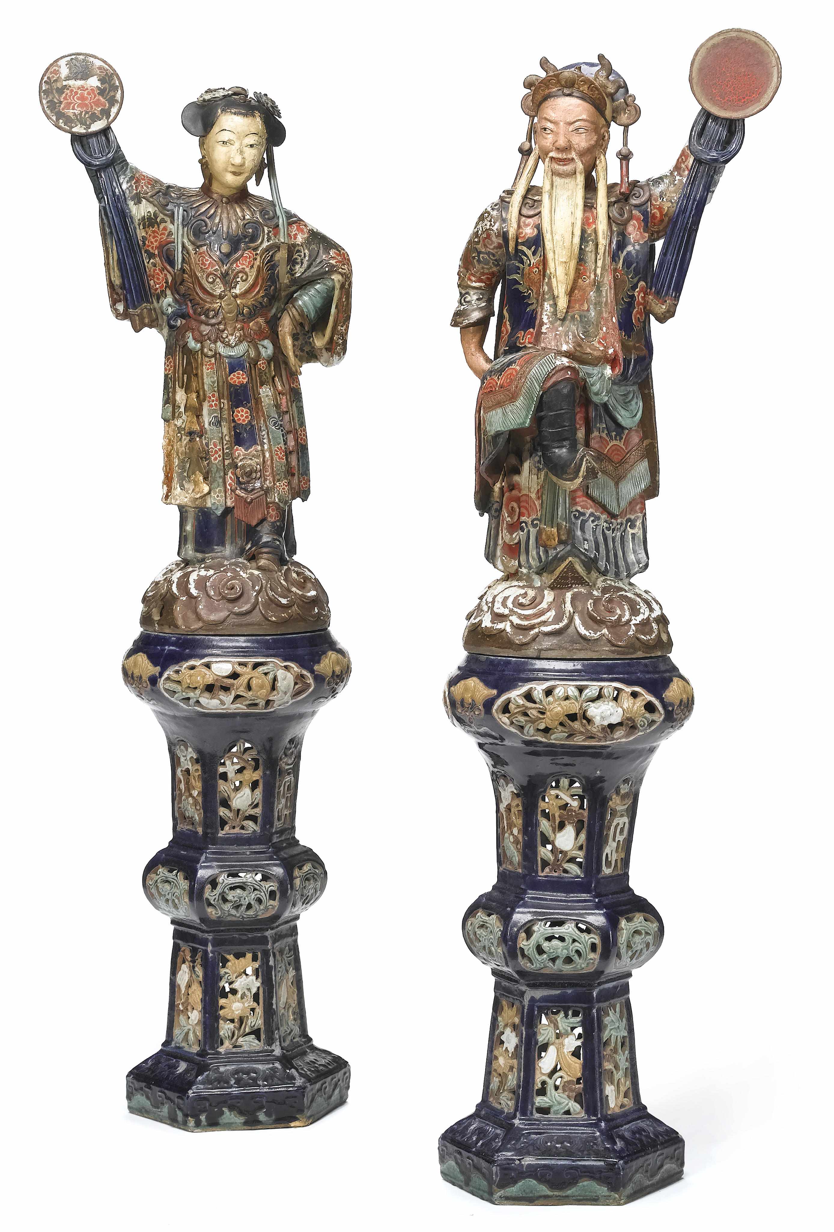 Appraisal: A pair of decorative Chinese style polychrome ceramic figures late