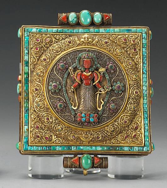 Appraisal: A Nepalese oversize copper ground amulet box with colored stone