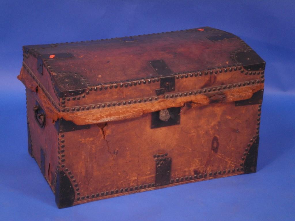 Appraisal: A thC leather cupboard cabin trunk with a slightly domed