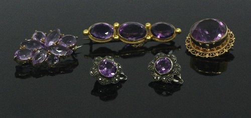 Appraisal: An amethyst brooch the large circular stone in a ct