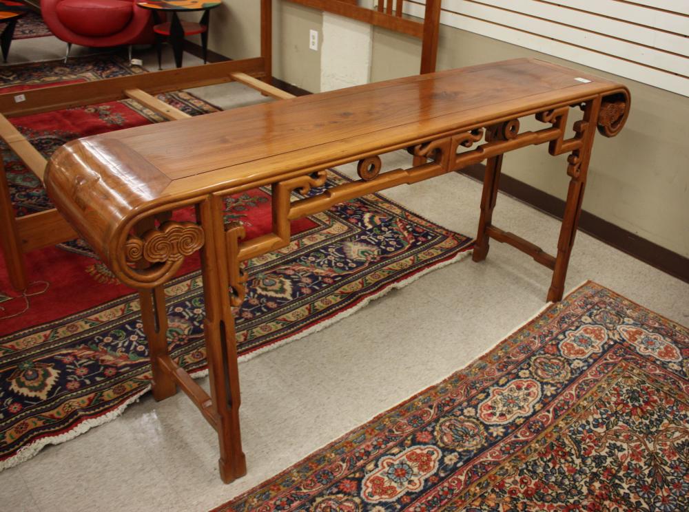 Appraisal: CHINESE MING-STYLE ELMWOOD ALTAR TABLE having cylindrical end scrolls pierced